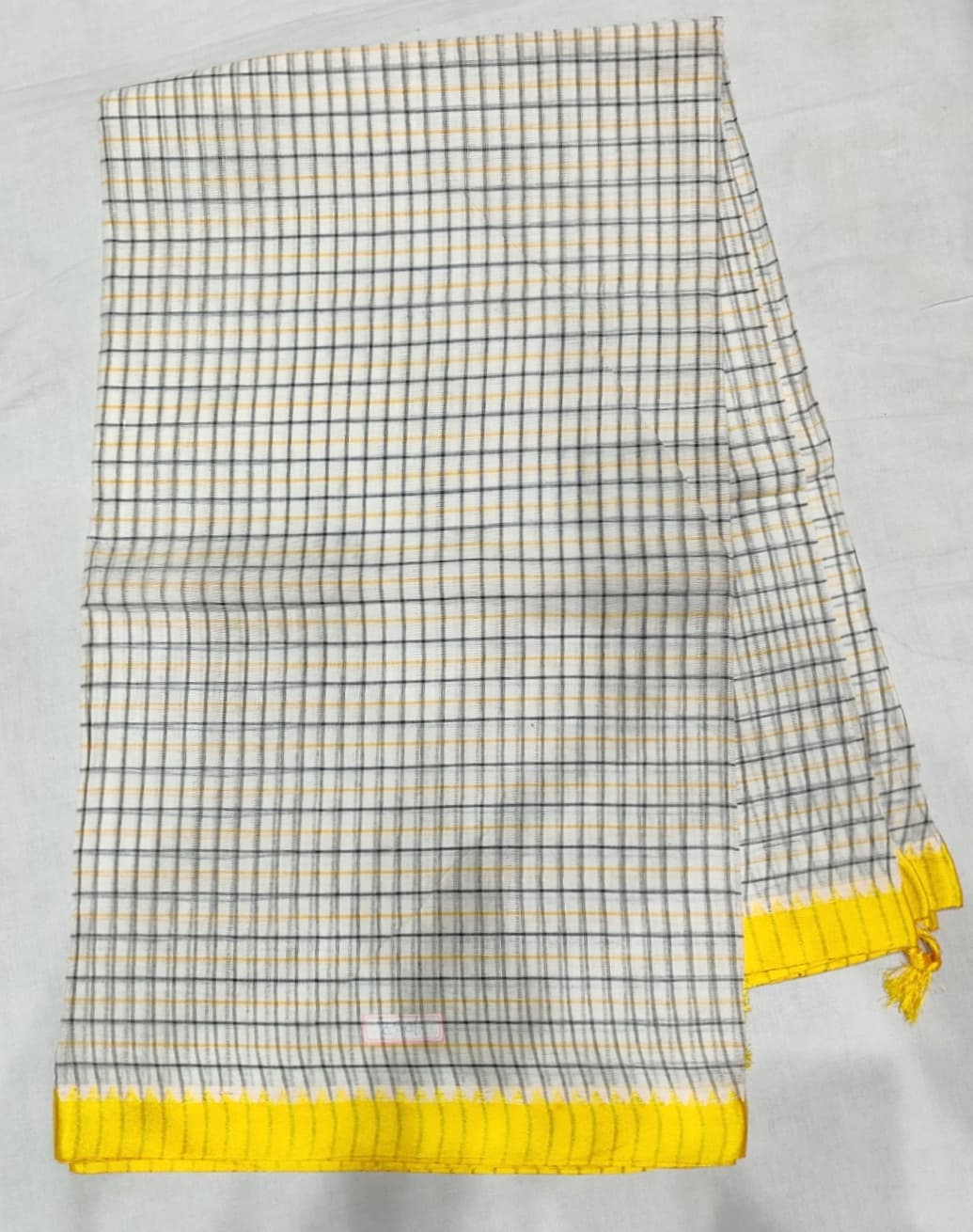 <p><em>Stripes and checks are common in Dhonekhali saris.</em></p>