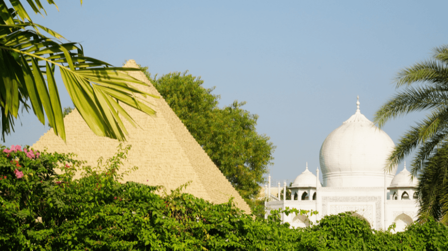 <p>A replica of the Egyptian Pyramids in front with the Taj Mahal gleaming in the background.</p>