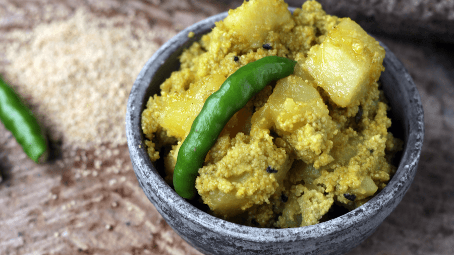 <p>A beloved Bengali staple, Alu Posto, features the nutty coating of posto over tender potatoes.</p>