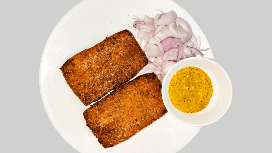 <p>Bengali fish fry with its true companion — sharp, fermented kasundi.&nbsp;</p>