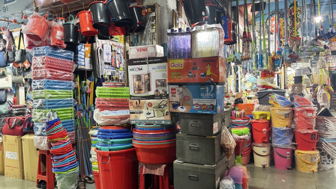 <p>Cleaning items such as buckets, mops, dustpans and brooms on display.</p>
